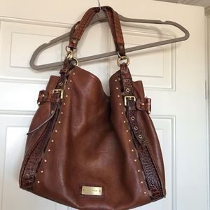 Brown leather shoulder bag with animal print